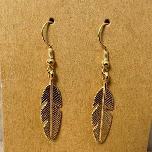Small dangling gold feather earrings